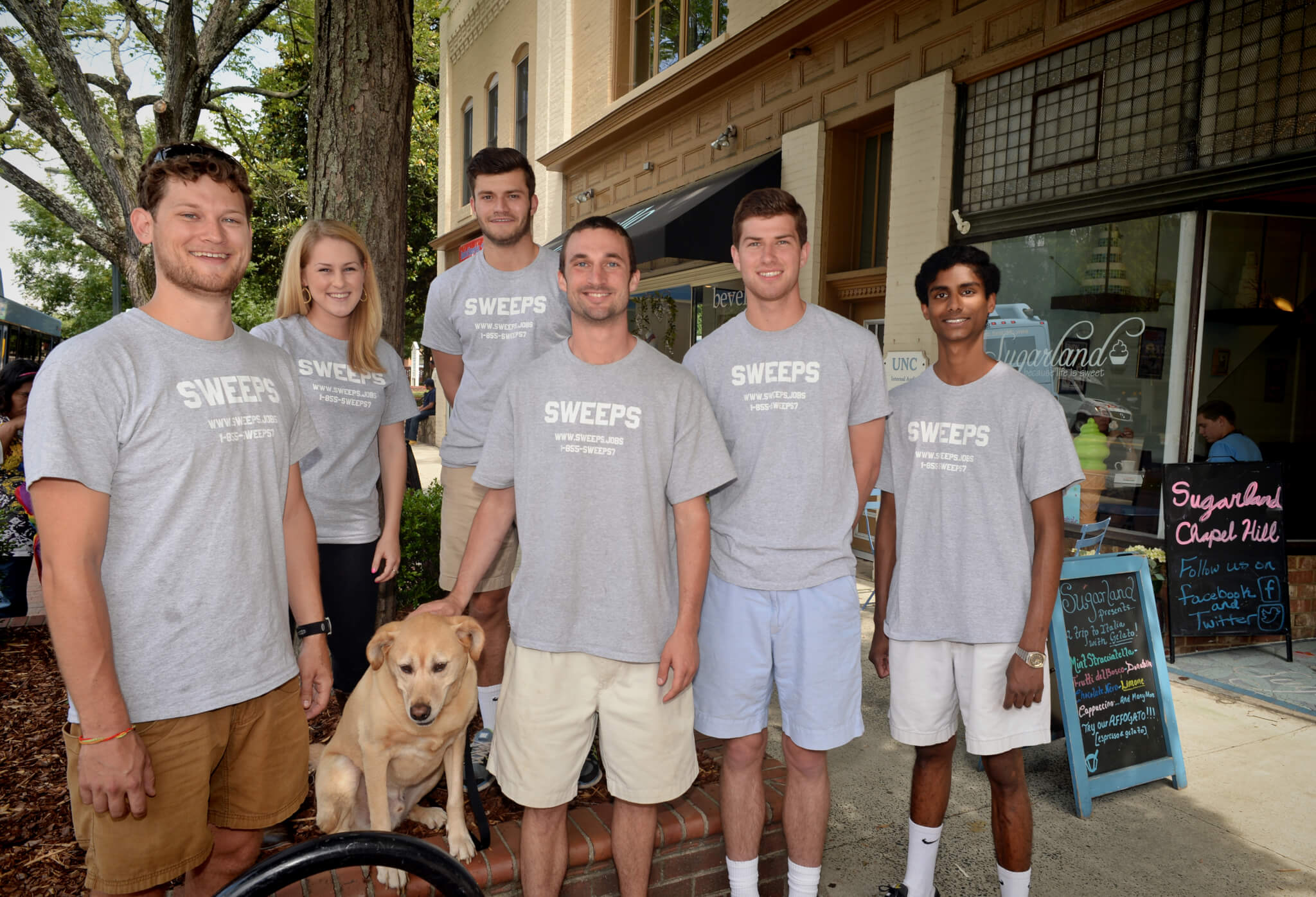 Members of the Sweeps team stand on Franklin Street