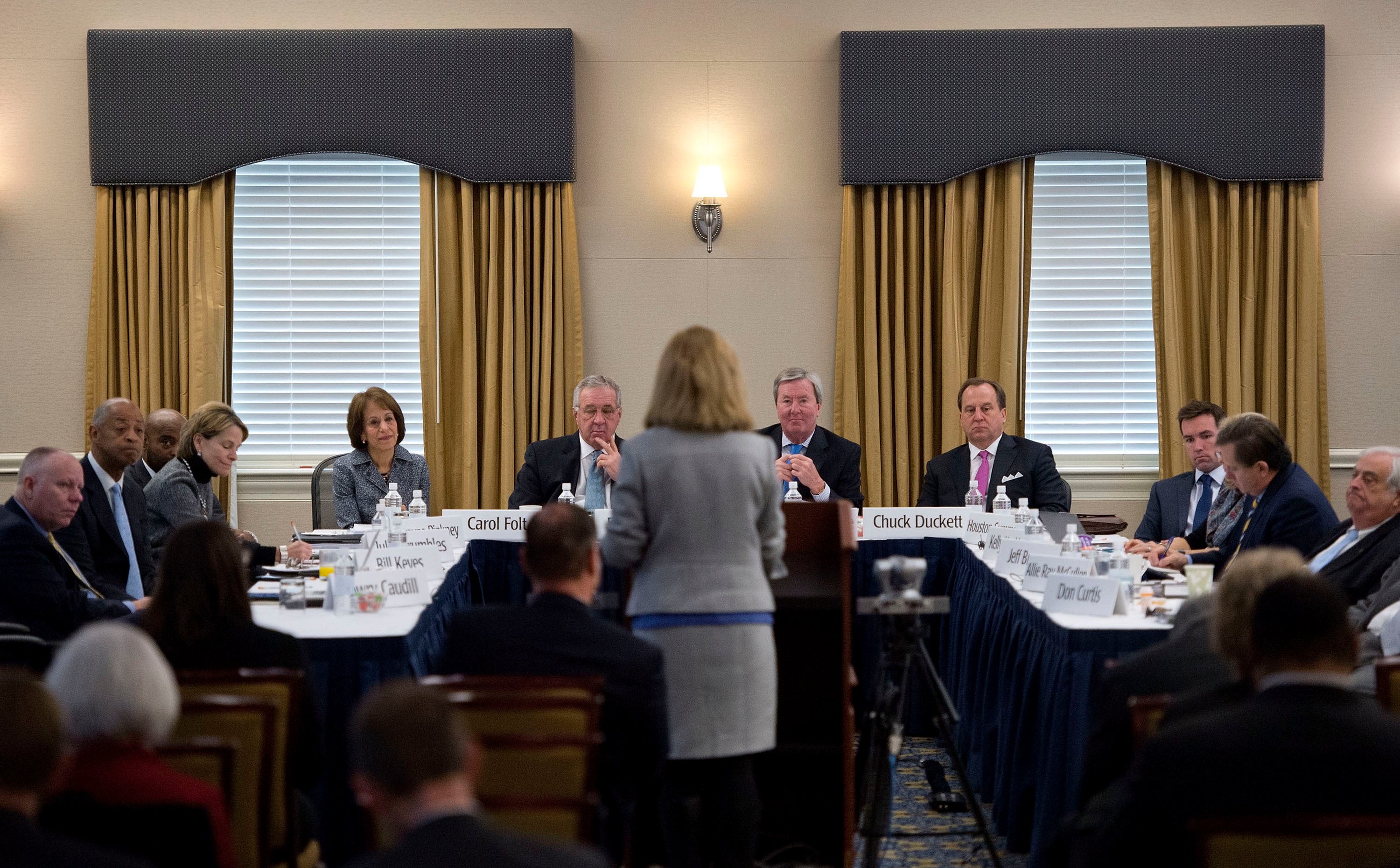 Julien Byerley speaks surrounded by the Board of Trustees.