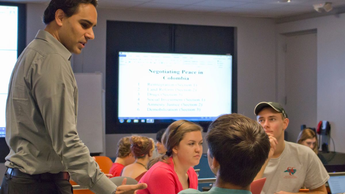 Professor Miguel La Serna lectures to students.