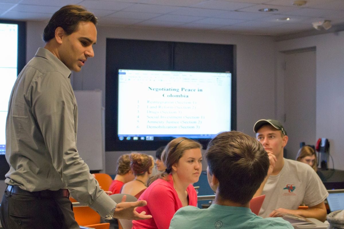 Professor Miguel La Serna lectures to students.