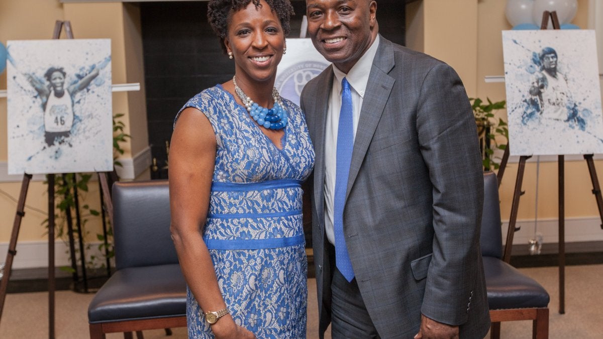 Sharon Couch-Fikes and Phil Ford stand together.