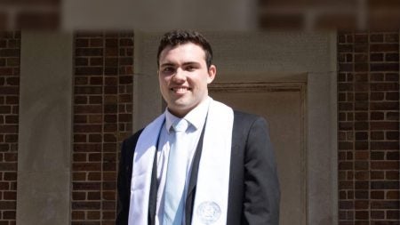 Brian Delany standing outside.