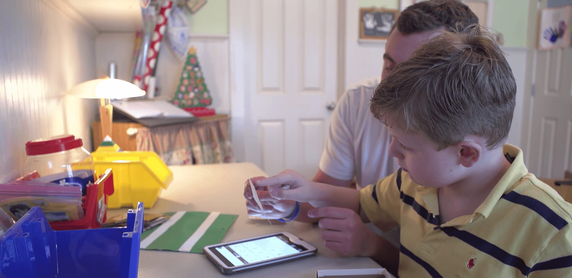 Austin Ludwig and Mason Ludwig play at a desk.