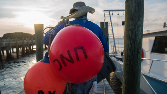 Claude Lewis carries buoys