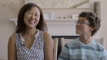 A woman and a boy laugh