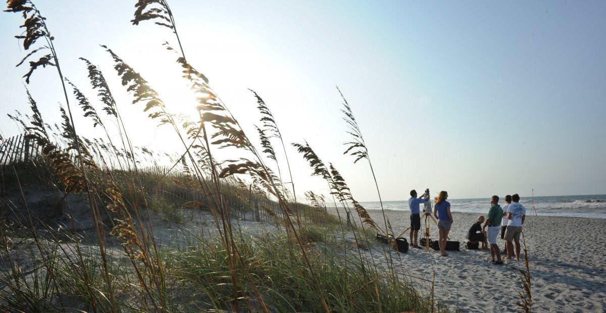 People research on the beach.