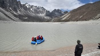 People paddle into a lake.
