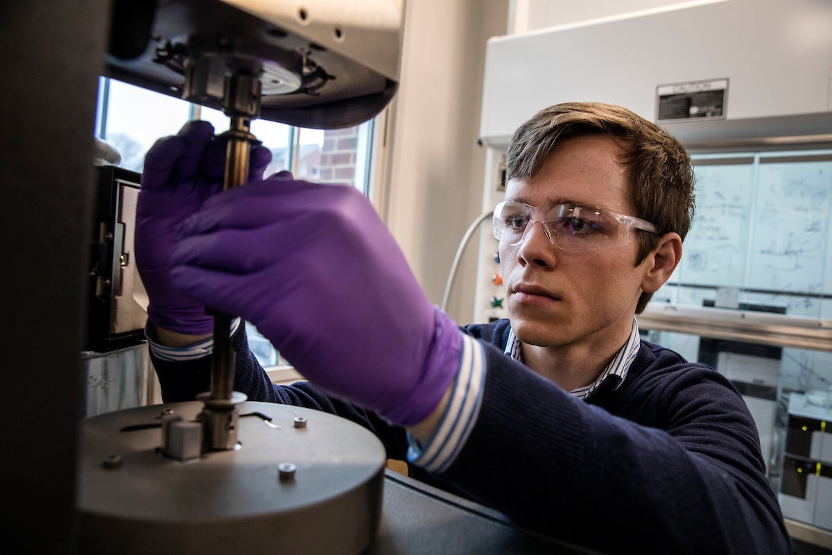 A graduate student works in a lab.