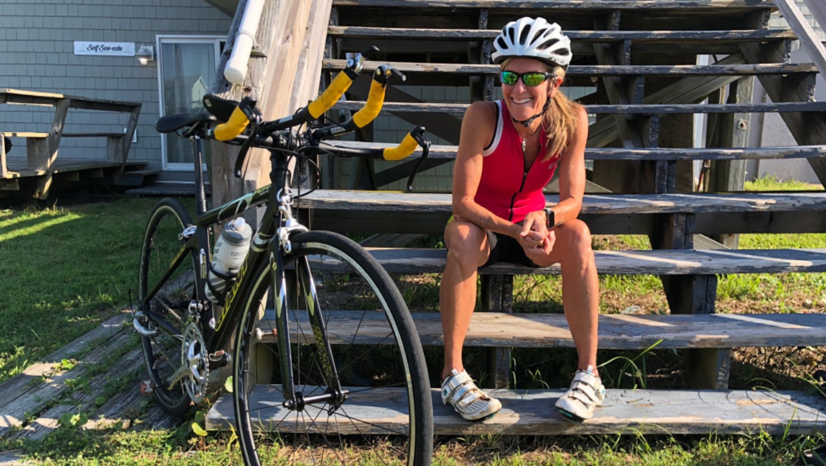 Molly Barker sits near her bike.