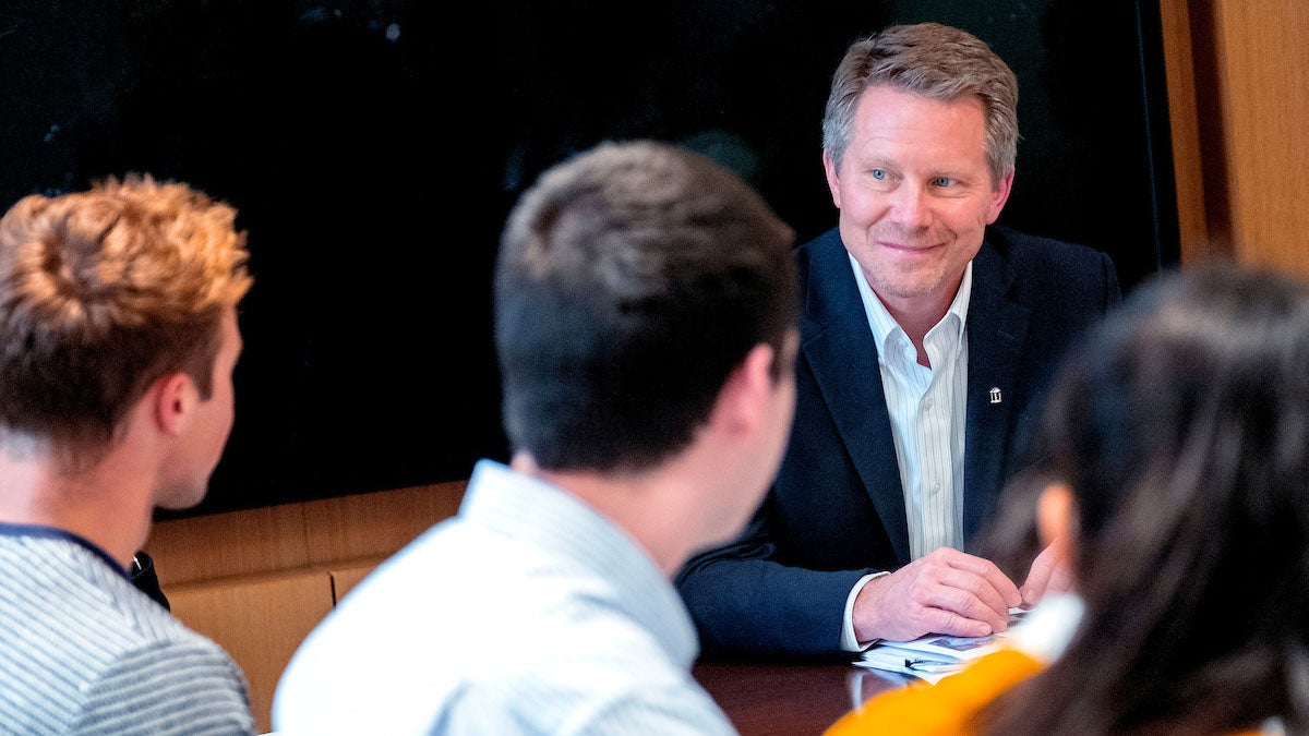 Interim Chancellor Kevin Guskiewicz talks with students.