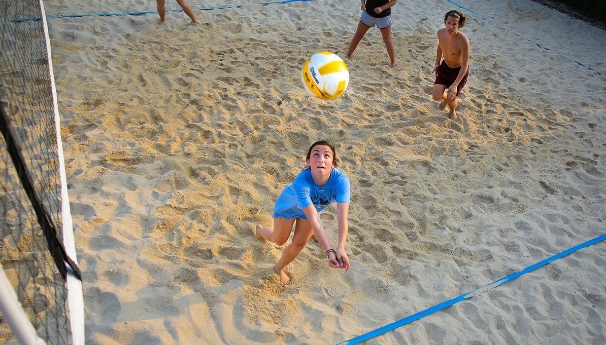 A woman playing volleyball