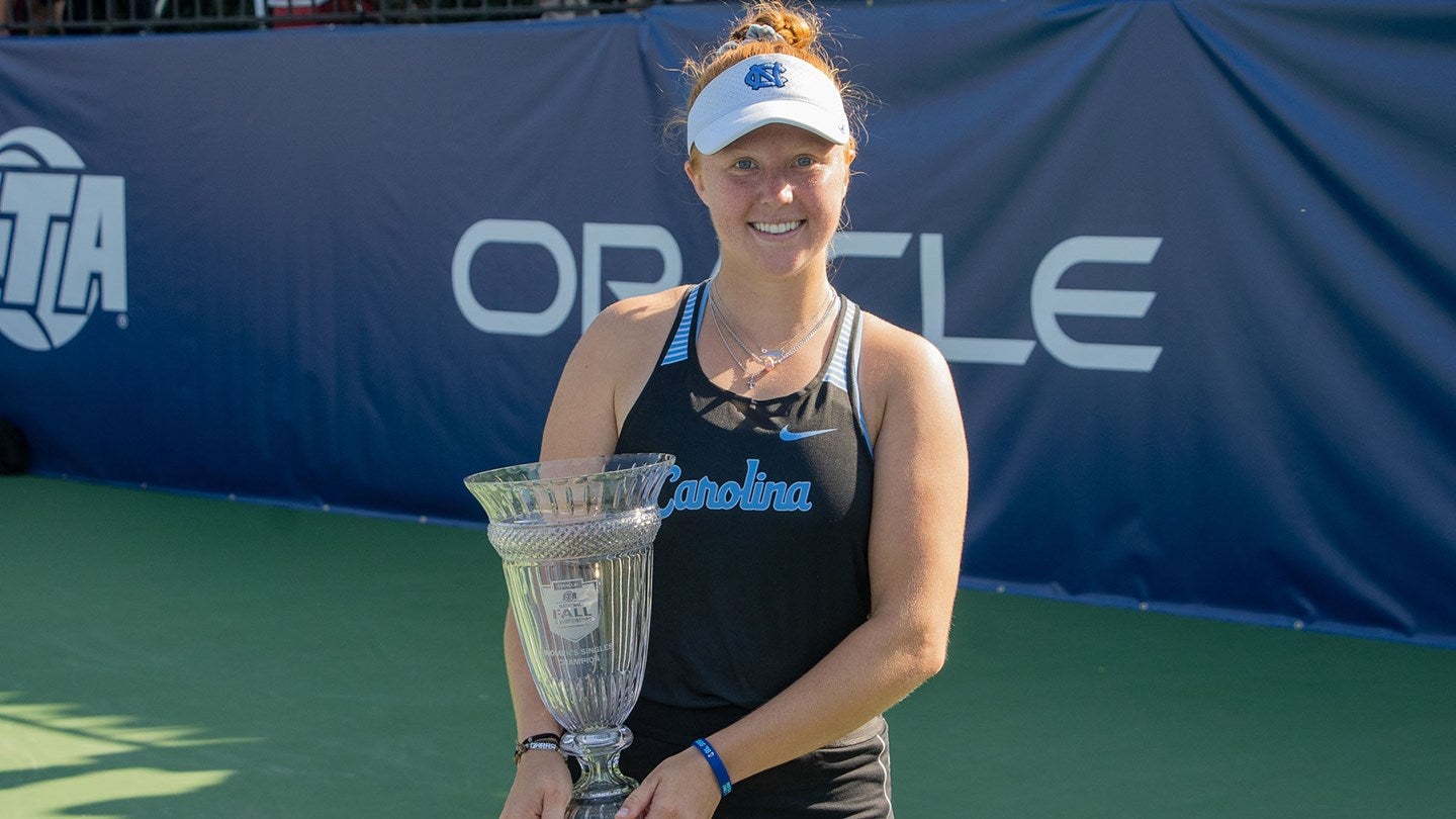 Sara Daavettila holds a trophy.