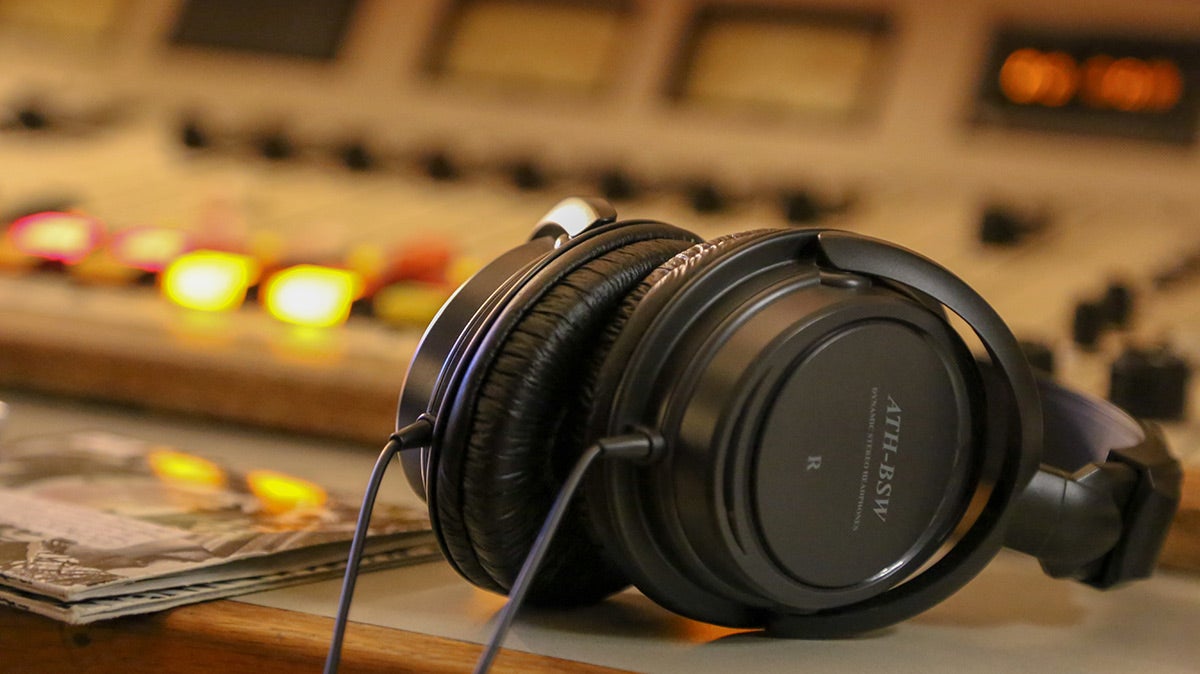headphones sitting a desk.
