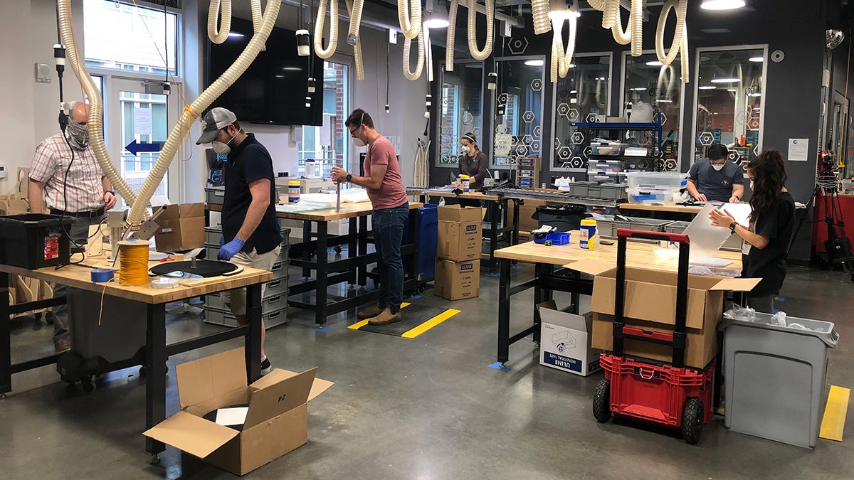 Carolina students work on producing face shields in the University's makerspace.