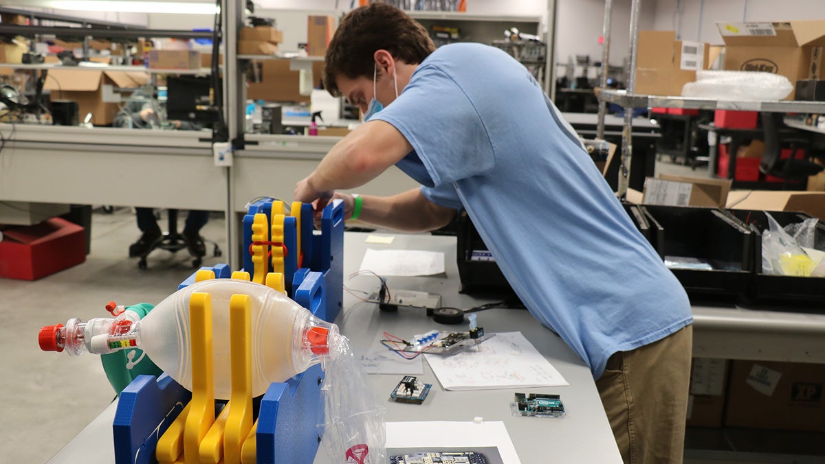 Thomas Kierski works on the ventilator prototype.