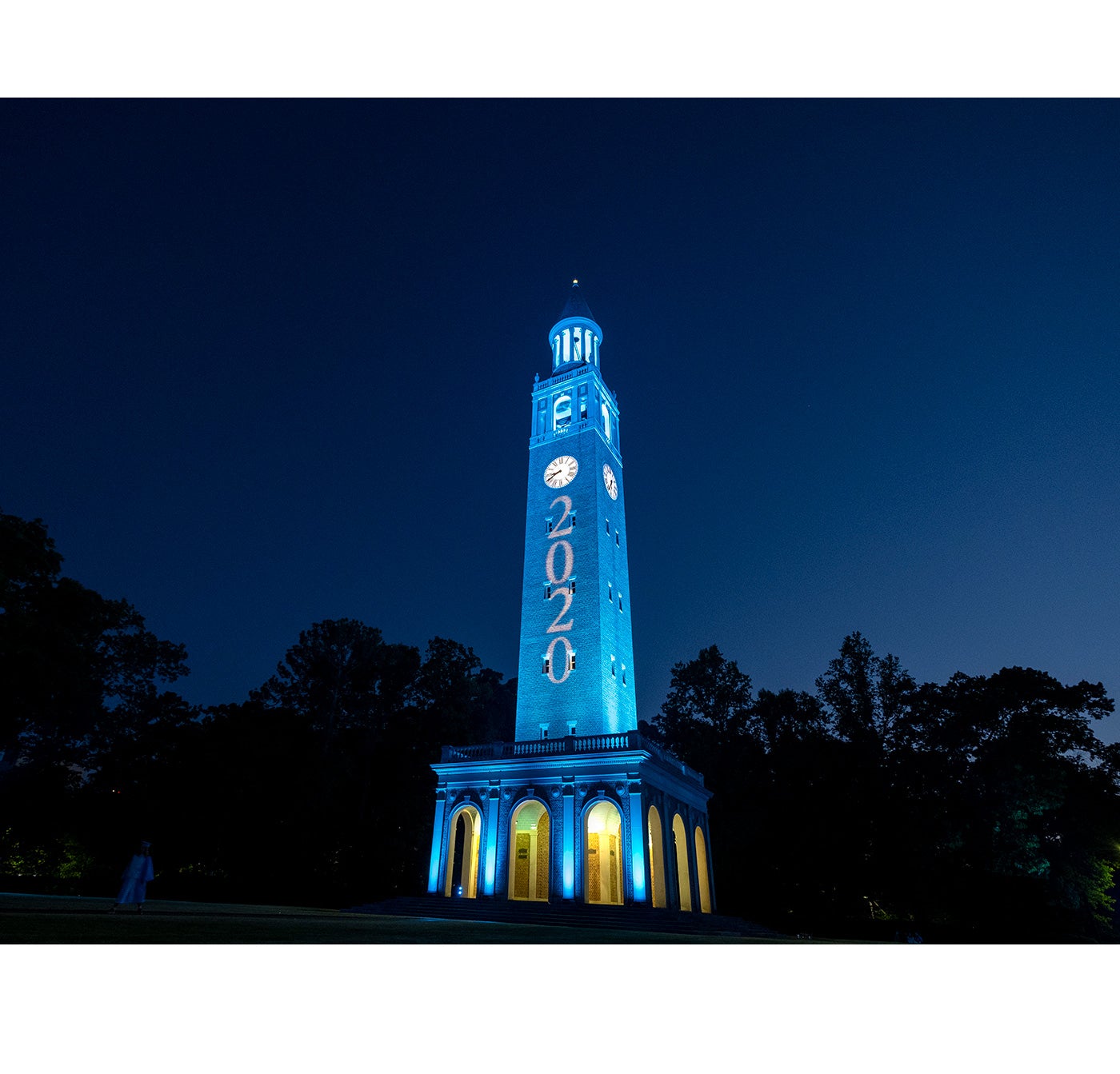 The Bell Tower lit up in Carolina blue.