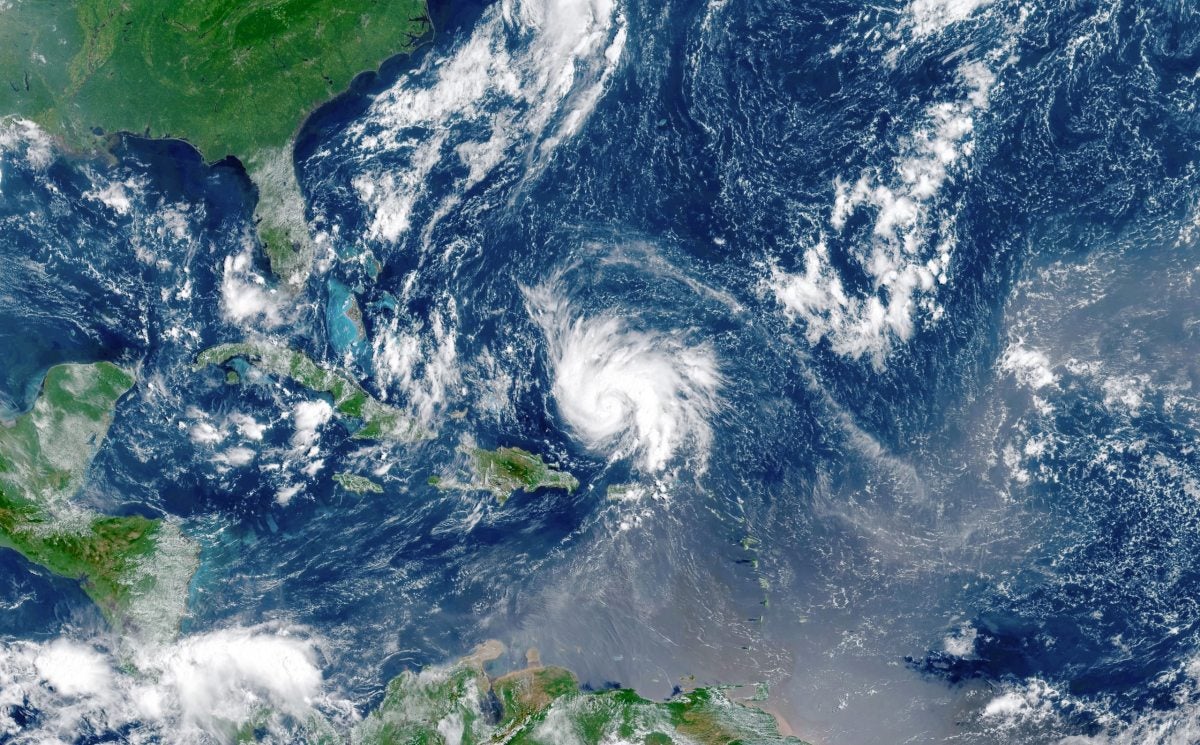 A satellite view of a hurricane forming in the Atlantic Ocean.
