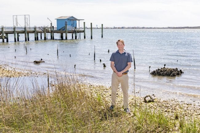 Mike Piehler poses on the beach