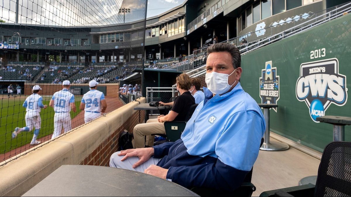 Mario Ciocca sits in the stands of a baseball stadium.