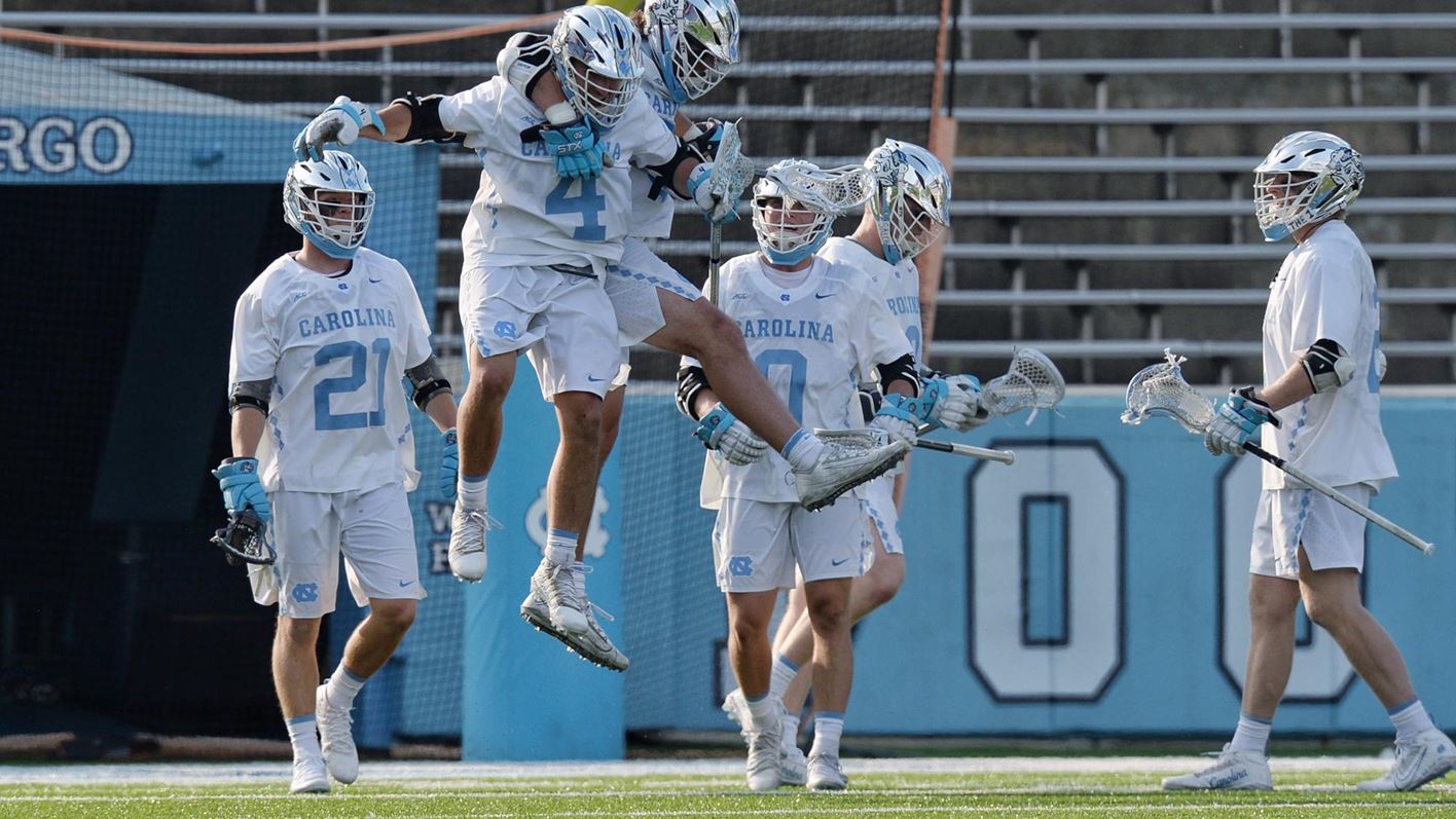 Players from Carolina's men's lacrosse team celebrate.