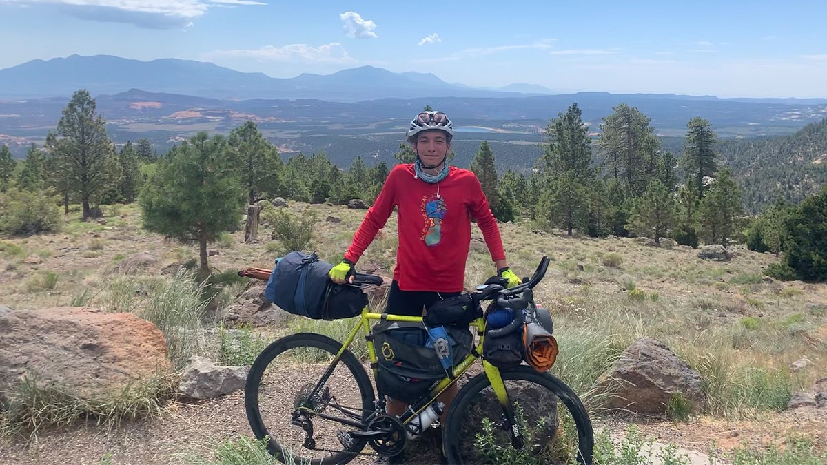 Emmaus in the mountains with his bike.