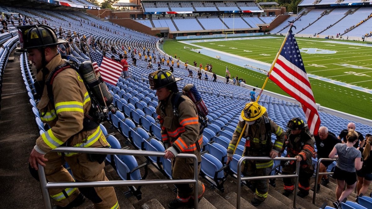 Firefighters climbing stairs.