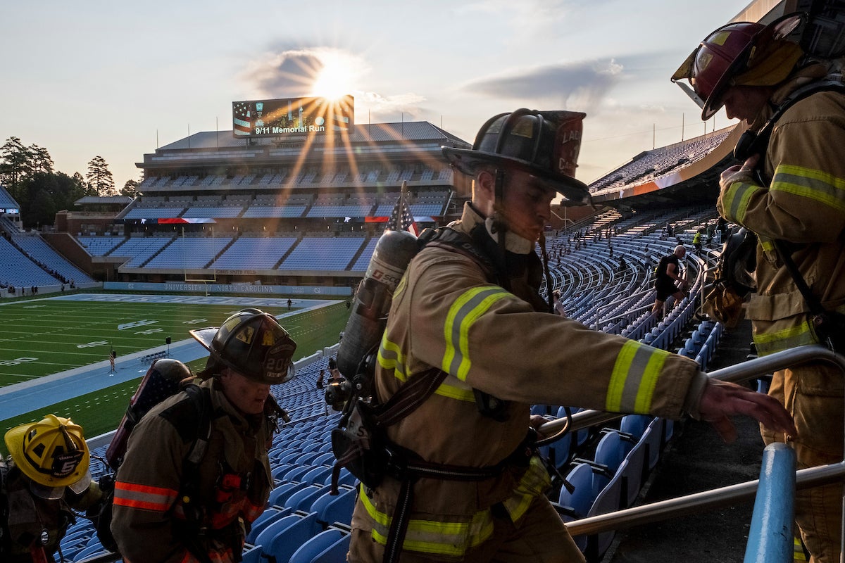 Firefighters climbing stairs.