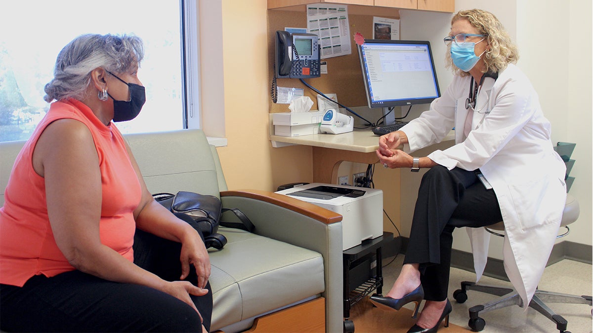A doctor talks with a patient.