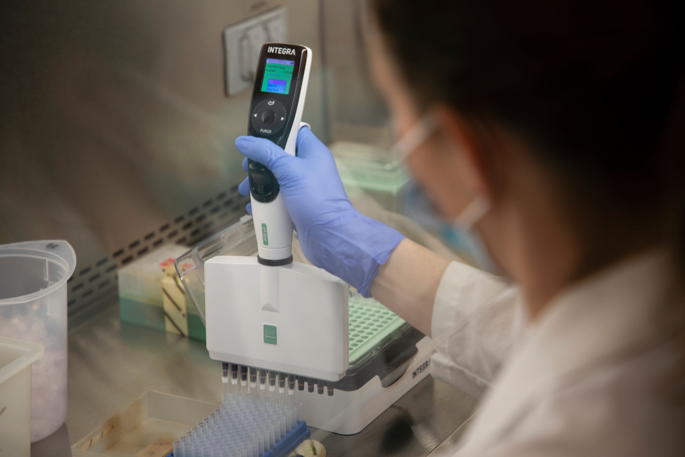 A person takes a lab reading.