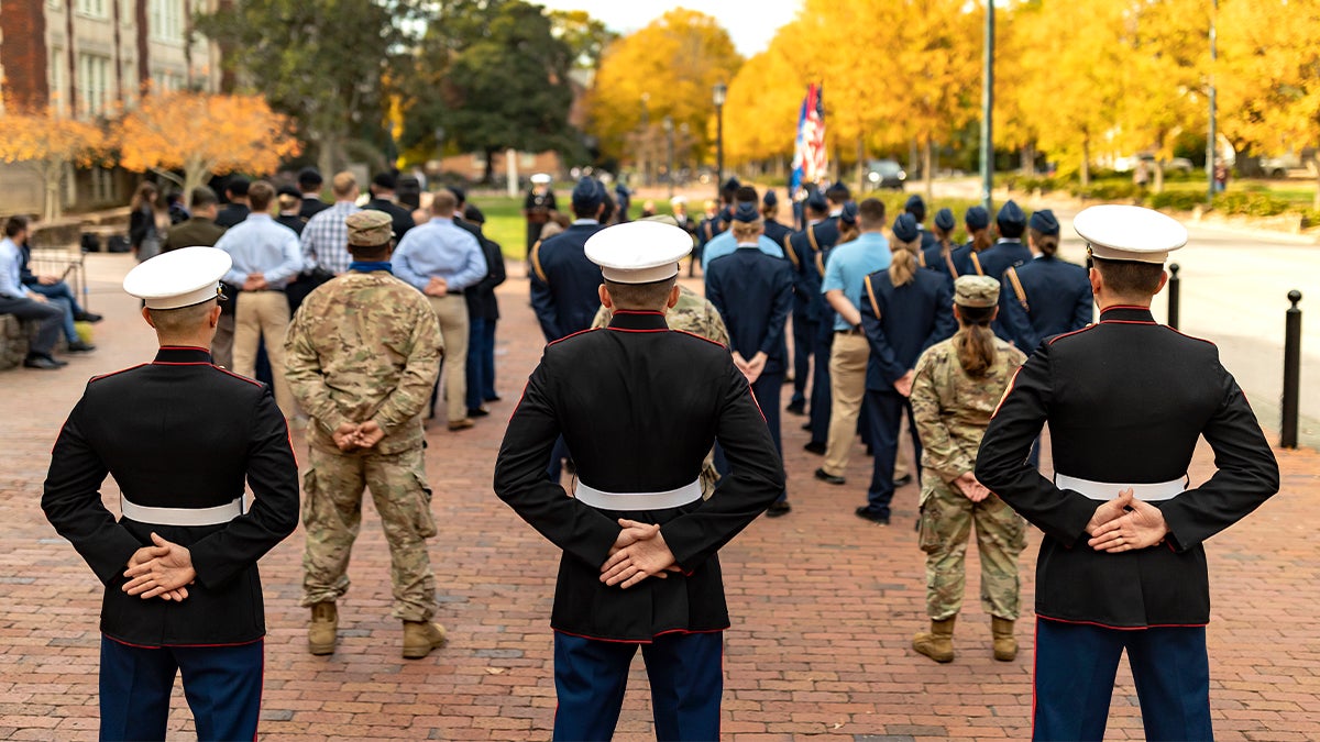 ROTC cadets stand at attention.