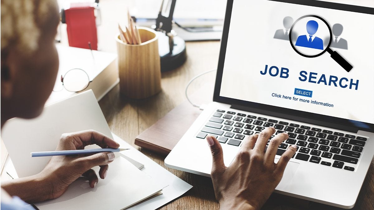 Laptop shows a Job Search screen