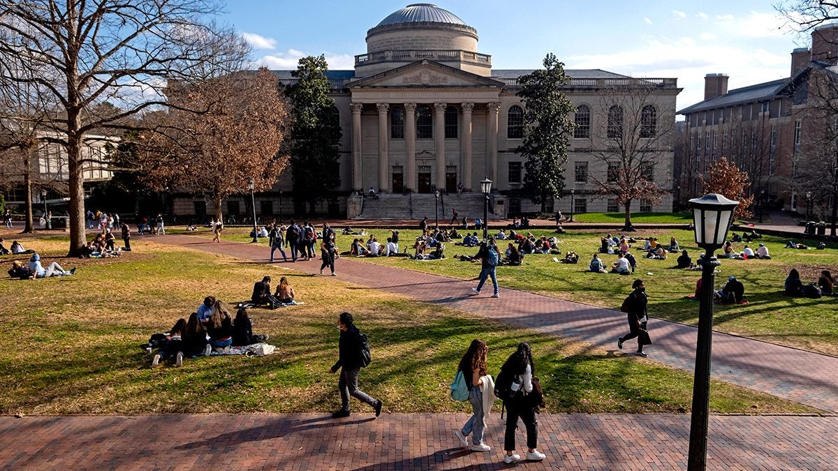 Students walking on polk place.