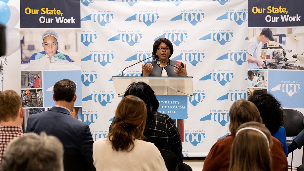 Anita Brown-Graham standing at the podium.