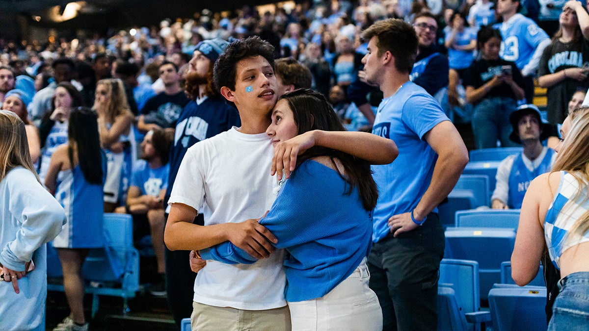 Two students hugging