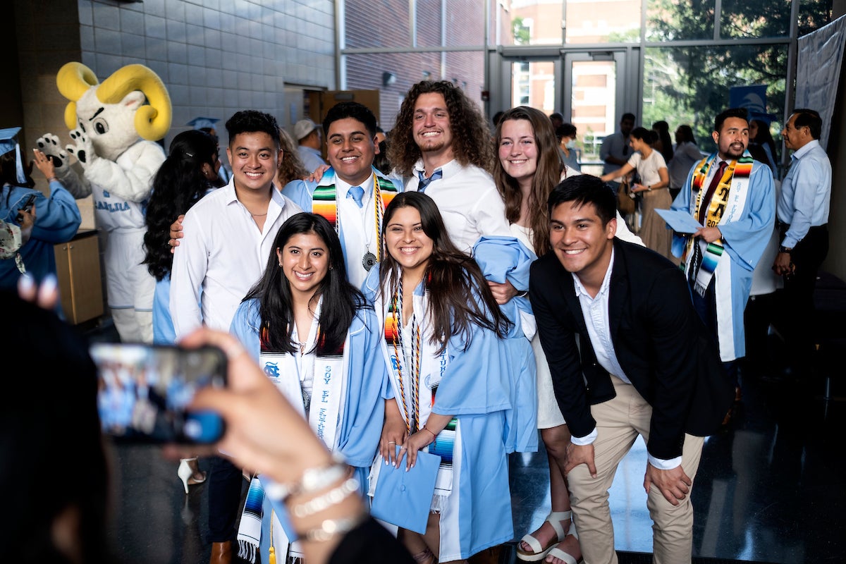 Graduates pose for a photo