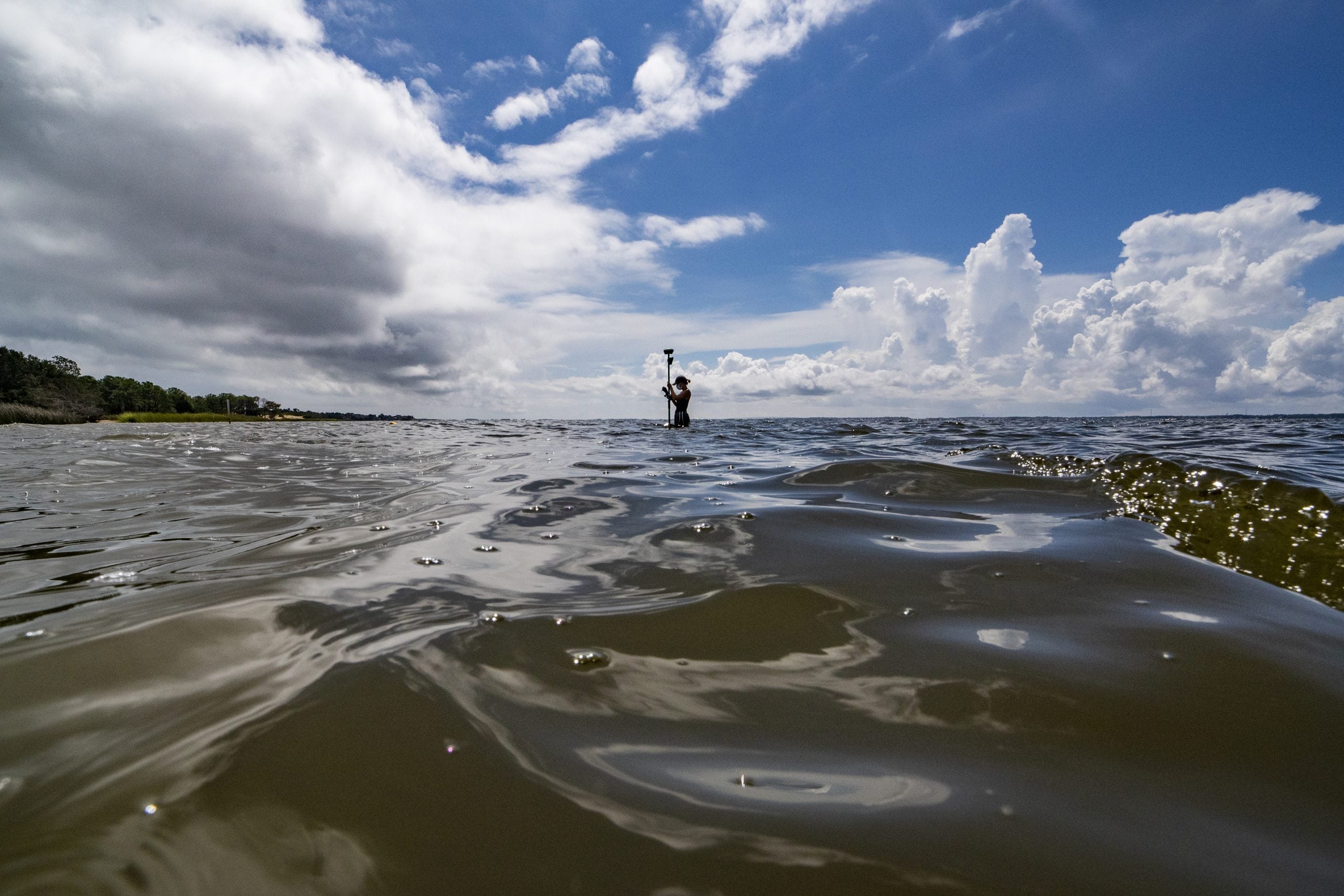 A person standing in the ocean.