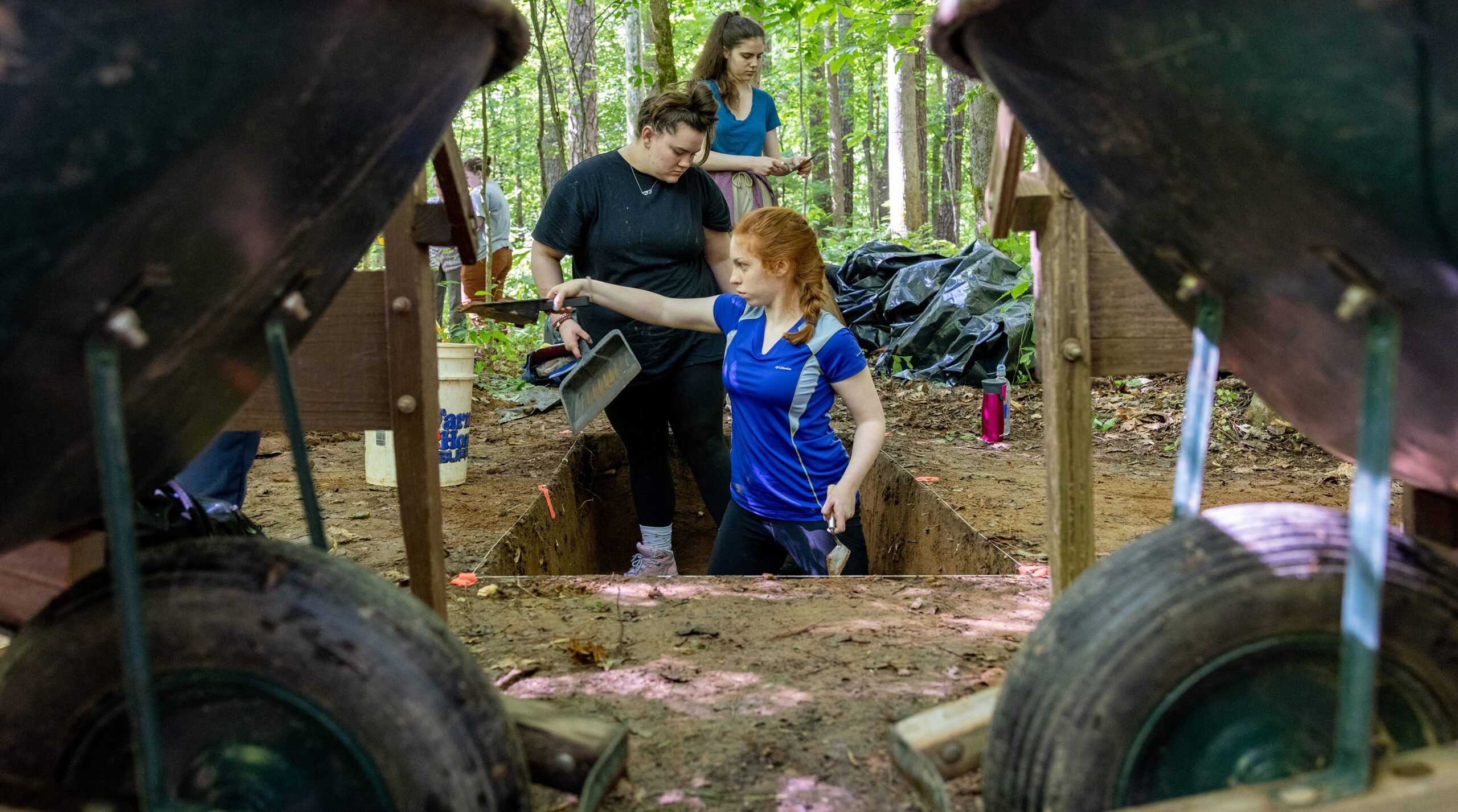 A person digging from a hole.