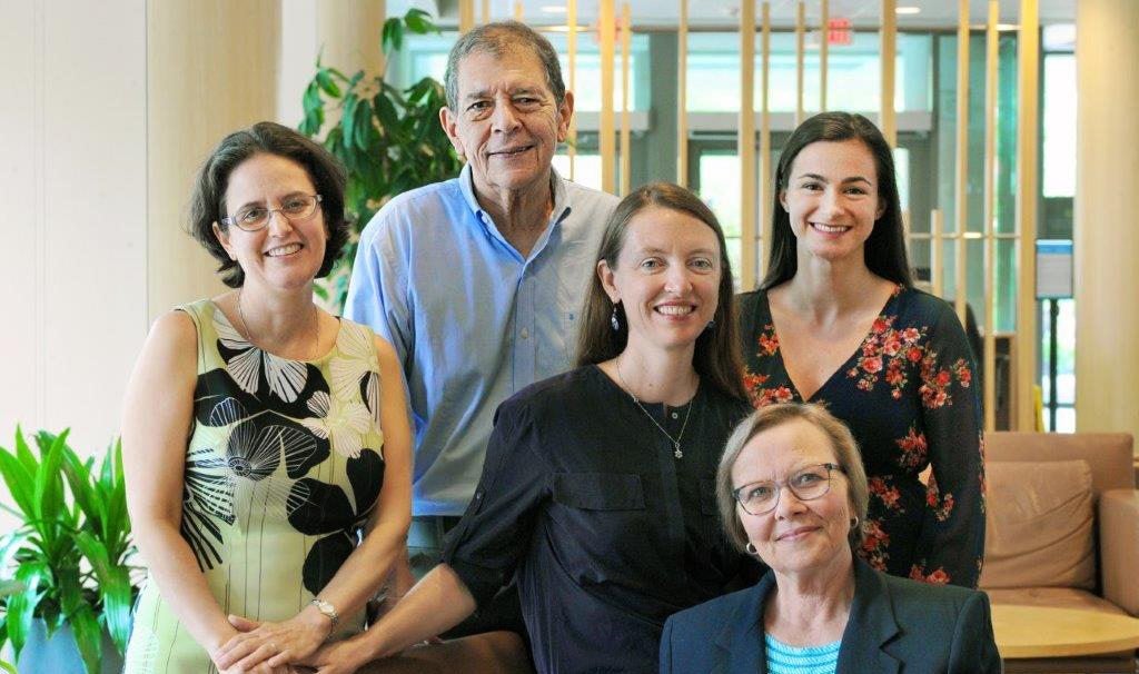 Five people sitting together at FedEx Global.