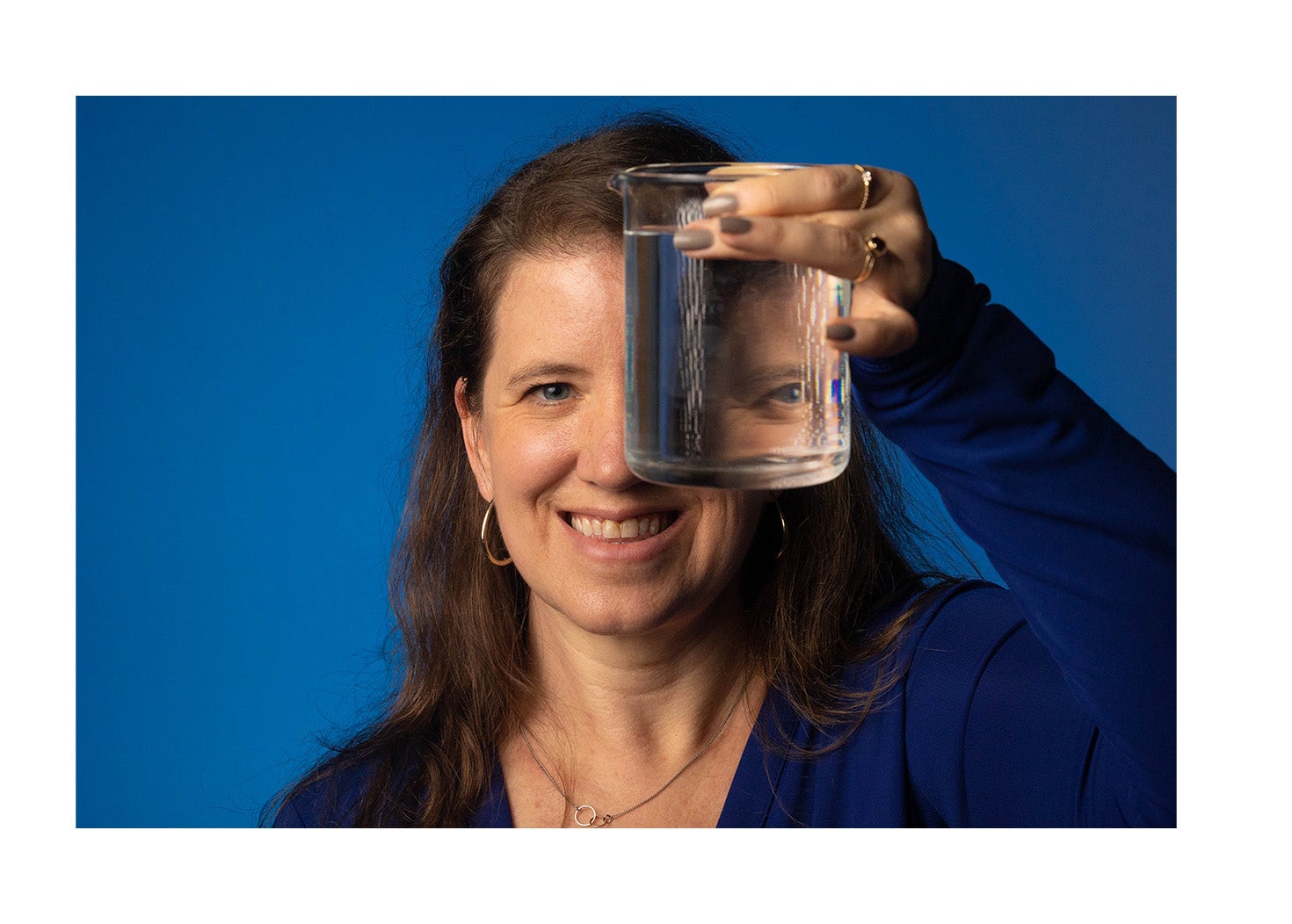 Amanda Thompson holding a container of water.