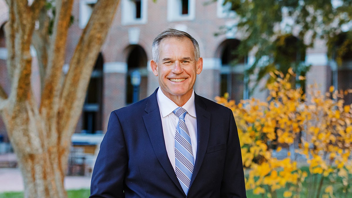 Doug Shackelford in front of McColl Building