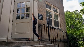 A student walking into the Carolina Latinx Center.