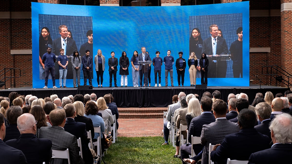 The chancellor speaking on stage.