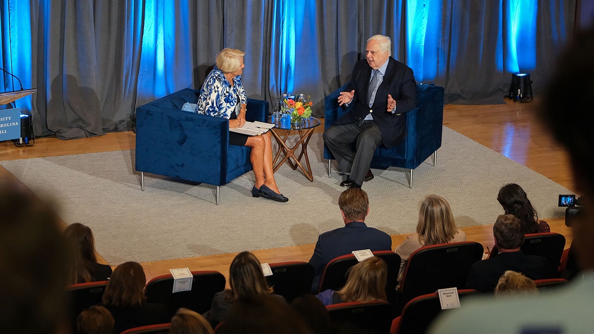 PEople talking on a stage.