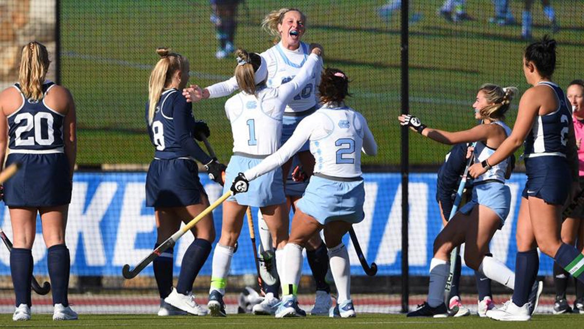 The field hockey team celebrates their win