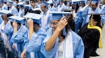Students their their tassels.