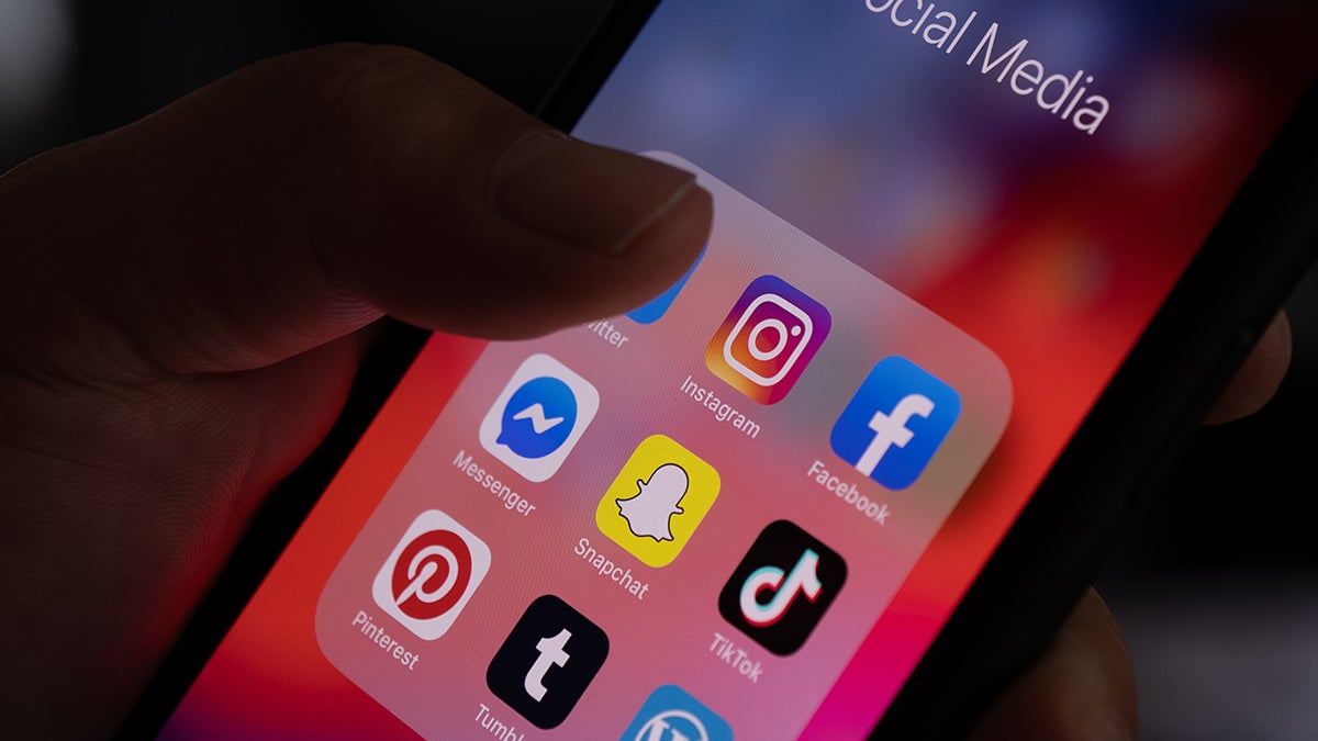 Social media apps on an iphone screen.