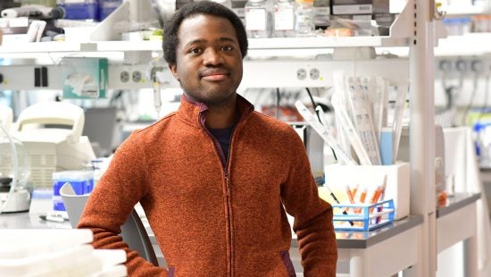 Jamshaid Shahir standing in a lab.