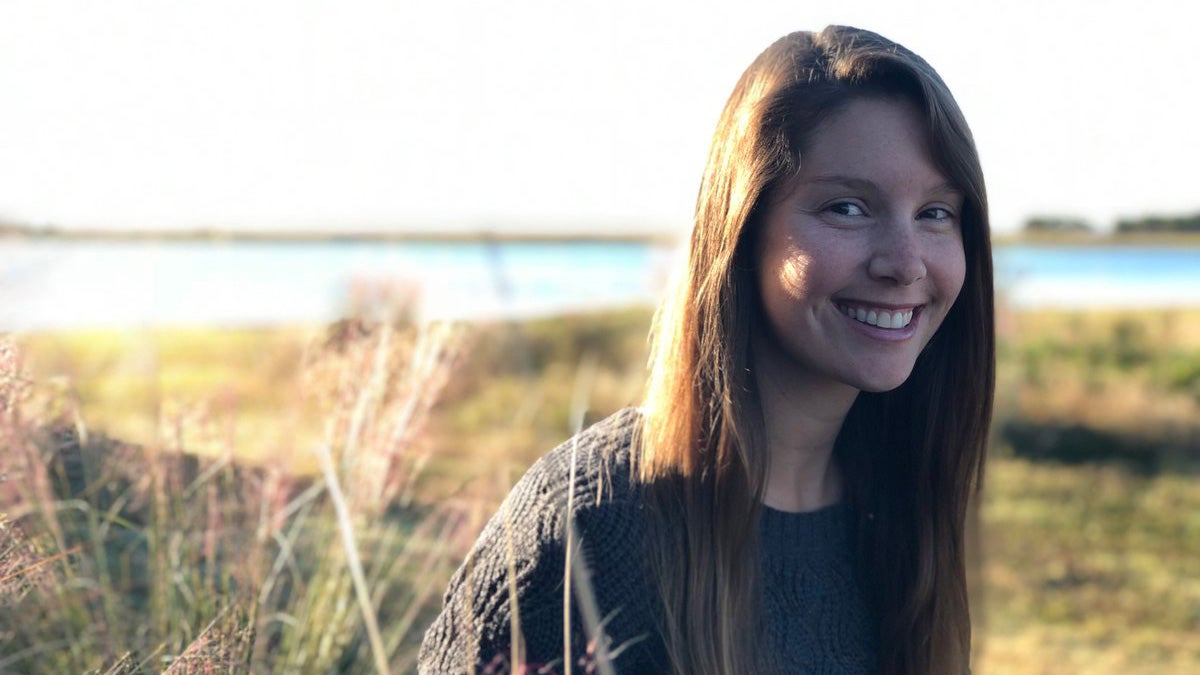 Molly Bost outside by the coast.