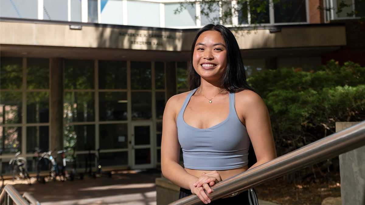 Audrey Zuck in front of Carmichael Residence Hall.
