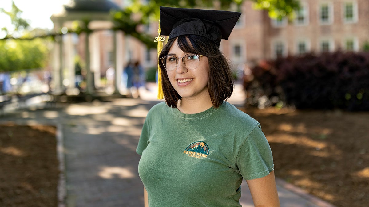 UNC graduate student Aria Princehorn by the Old Well.